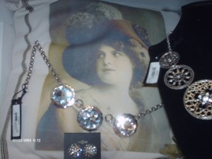 Necklace with large crystals in center. and a French theme pillows
